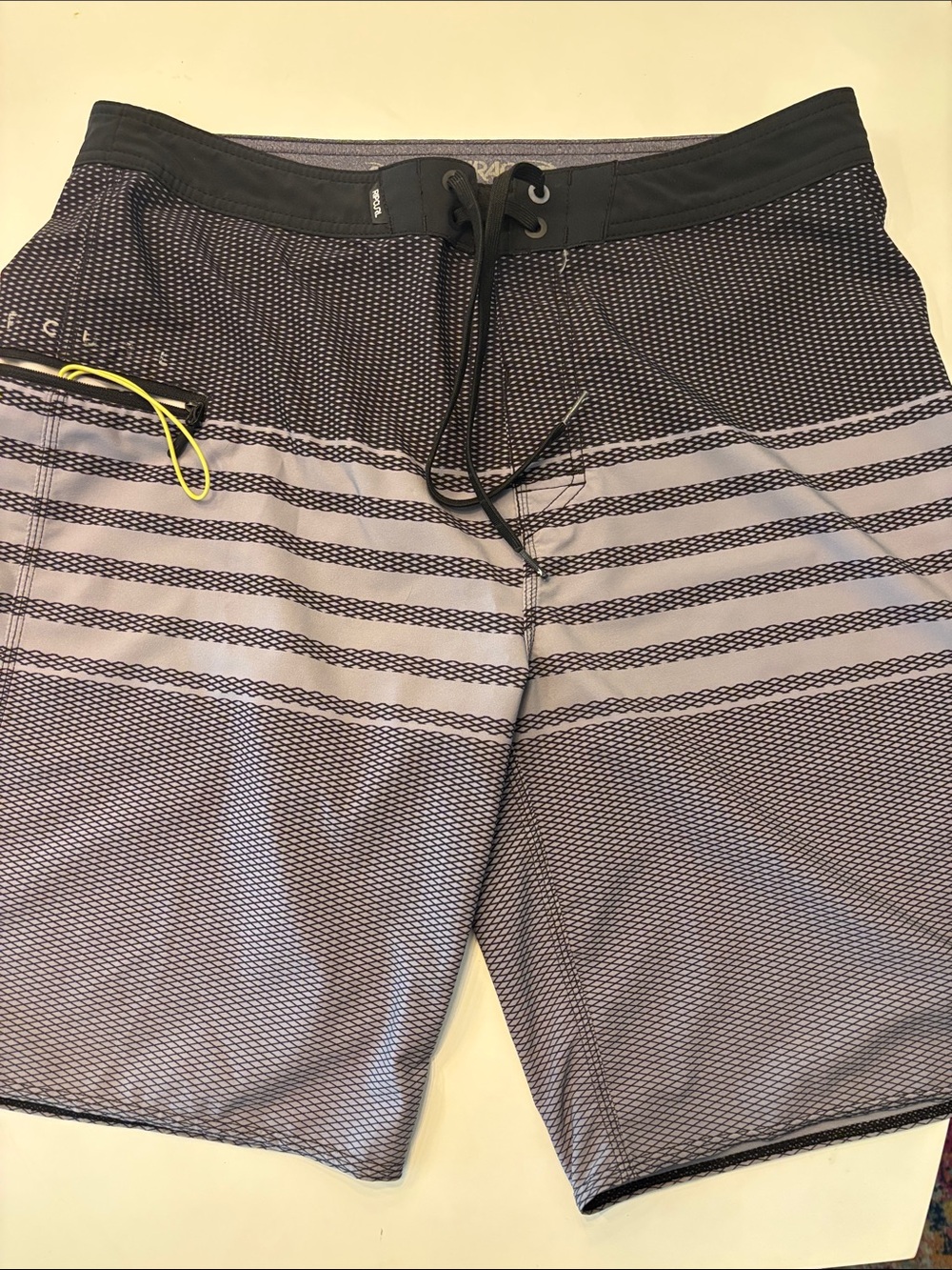 Rip Curl Black and Gray Striped Board Shorts with Neon Yellow Accent